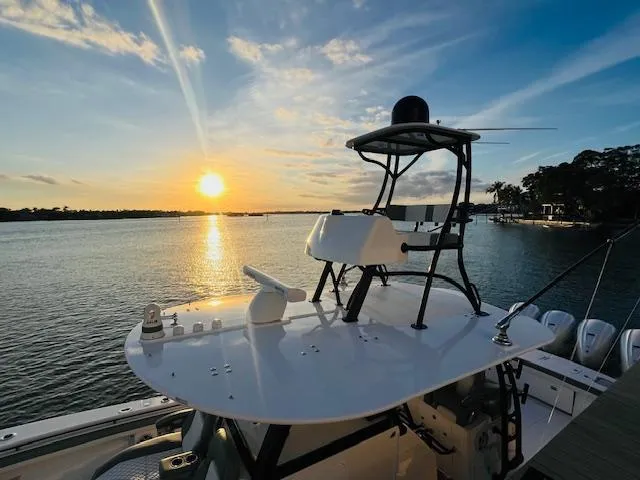 Slide: The Image of 2024 Regulator 41 boat at sunset on calm waters. - 19