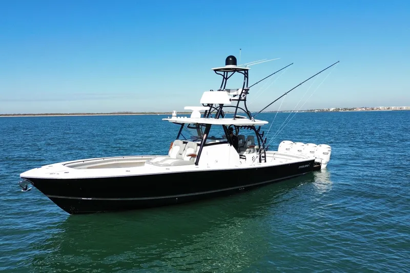 Slide: The Image of 2024 Regulator 41 boat on calm blue water under clear sky. - 4
