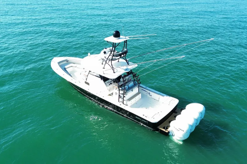 Slide: The Image of 2024 Regulator 41 boat on open sea, featuring sleek design and advanced fishing equipment. - 6