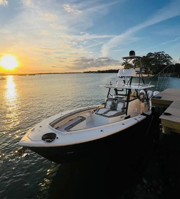 Slide: The Image of 2024 Regulator 41 boat docked at sunset, calm waters, scenic view. - 20