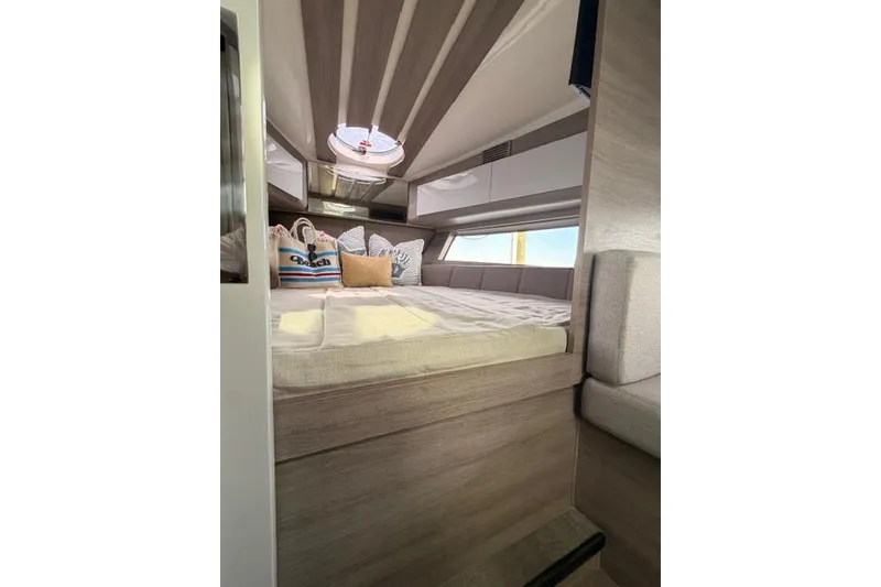 Slide: The Image of Luxurious interior cabin of 2025 Real 40 HT Luxury yacht with plush bedding. - 40