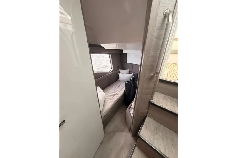 Slide: The Image of Luxurious cabin interior of 2025 Real 40 HT Luxury yacht, featuring modern design and cozy bedding. - 34