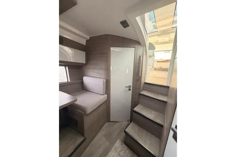 Slide: The Image of Interior of 2025 Real 40 HT Luxury yacht with modern seating and staircase. - 37