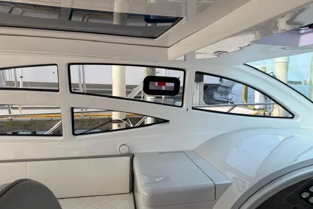 Slide: The Image of Interior view of 2025 Real 40 HT Luxury yacht, featuring sleek design and modern windows. - 19