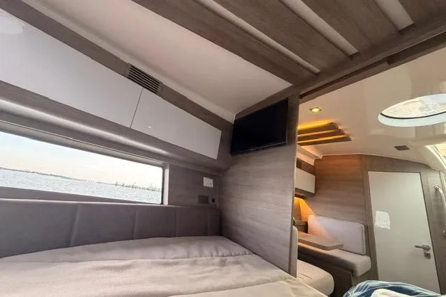 Slide: The Image of Luxurious interior of 2025 Real 40 HT yacht with modern design and scenic window view. - 33