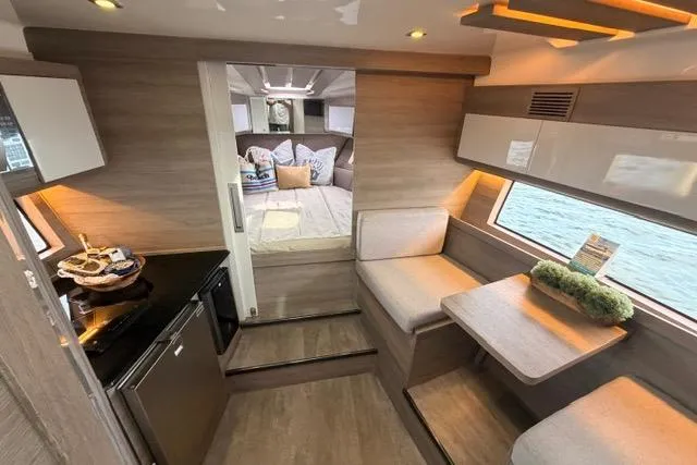 Slide: The Image of Luxurious interior of 2025 Real 40 HT yacht with modern seating and kitchenette. - 30