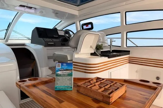 Slide: The Image of Interior of 2025 Real 40 HT Luxury yacht with modern helm and wooden table. - 23