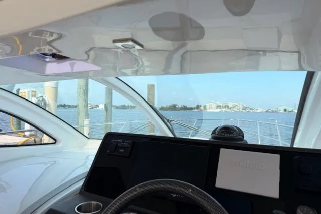 Slide: The Image of Interior view of 2025 Real 40 HT Luxury yacht cockpit with waterfront scenery. - 20