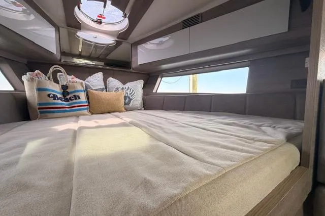 Slide: The Image of Luxurious interior of 2025 Real 40 HT yacht with cozy bedding and stylish decor. - 36