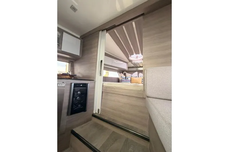 Slide: The Image of Interior of 2025 Real 40 HT Luxury yacht, featuring modern design and cozy sleeping area. - 41