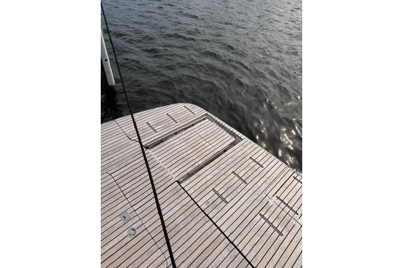 Slide: The Image of Luxury yacht deck of 2025 Real 40 HT, overlooking serene water. - 28