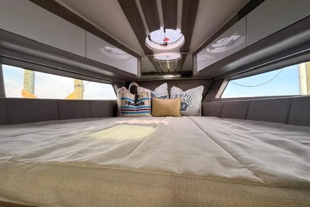 Slide: The Image of Luxurious interior of 2025 Real 40 HT yacht with cozy bedding and stylish decor. - 35