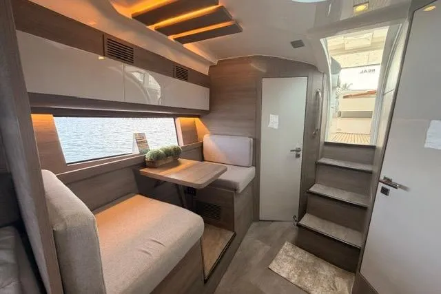 Slide: The Image of Luxurious interior of 2025 Real 40 HT yacht, featuring modern seating and elegant design. - 32