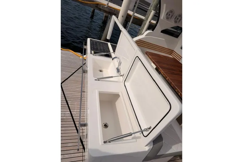 Slide: The Image of Luxury yacht kitchen area with sink and storage, Real 40 HT Luxury 2025 model. - 29