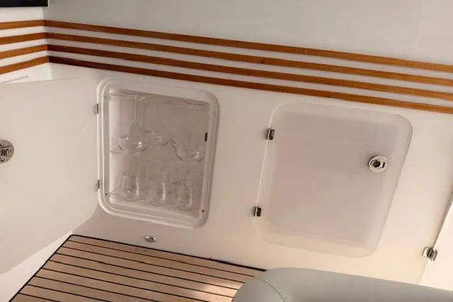 Slide: The Image of Luxury yacht interior with glass storage, Real 40 HT Luxury 2025 model. - 25
