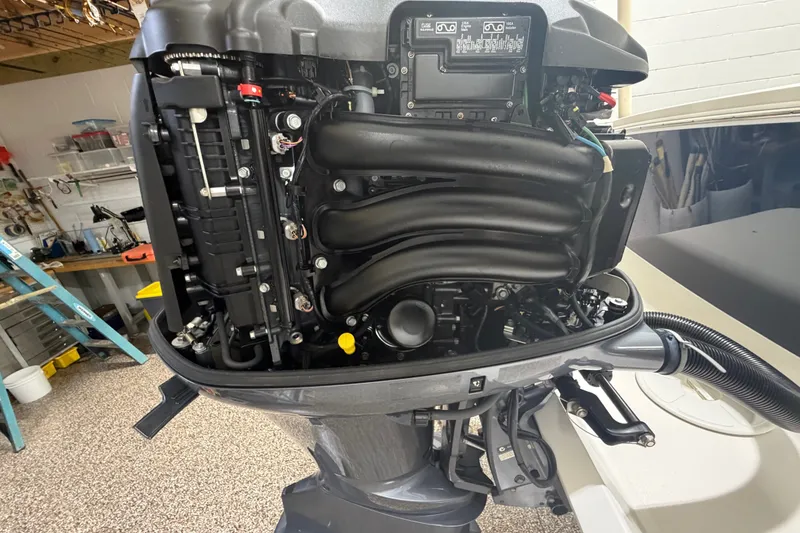 Slide: The Image of 2015 Regulator 23 outboard engine, detailed view in a workshop setting. - 46
