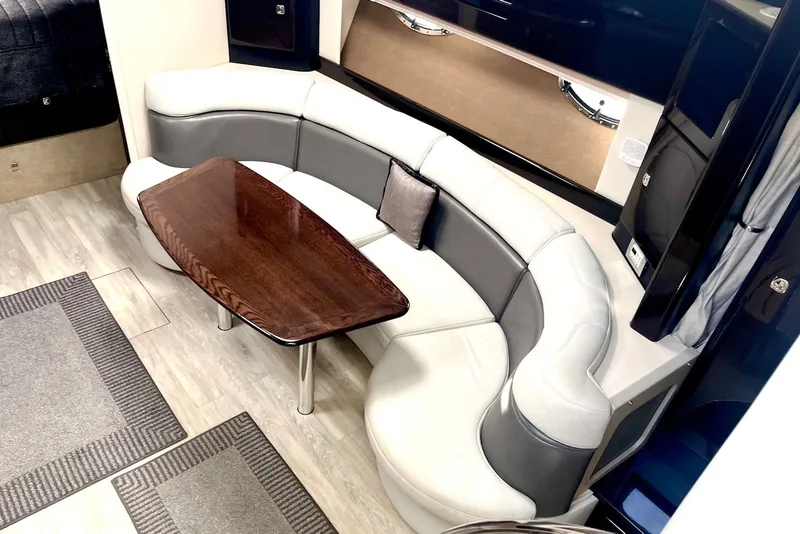 Slide: The Image of Luxurious interior of a 2016 Formula 37 Performance Cruiser with elegant seating and wooden table. - 5