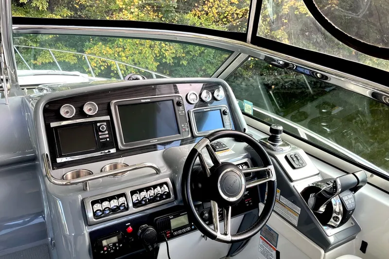Slide: The Image of Helm of 2016 Formula 37 Performance Cruiser with advanced navigation controls and displays. - 3