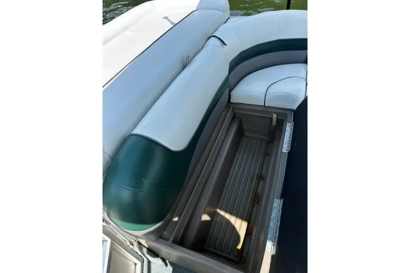 Slide: The Image of 2004 Sun Tracker Party Barge 22 I/O Regency Edition with open storage compartment. - 17