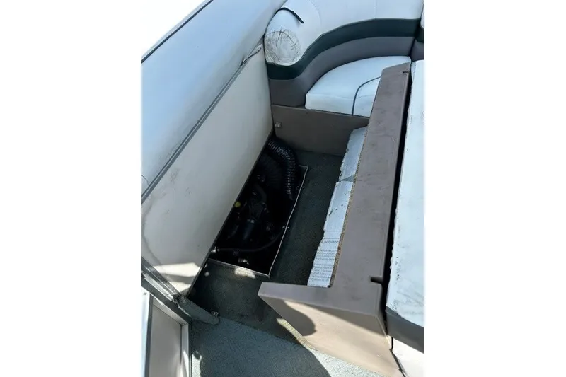 Slide: The Image of 2004 Sun Tracker Party Barge 22 I/O Regency Edition interior seating and storage area. - 15