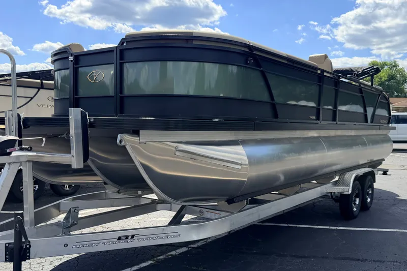 Slide: The Image of 2027 Veranda VR265VLC pontoon boat on trailer under blue sky. - 2