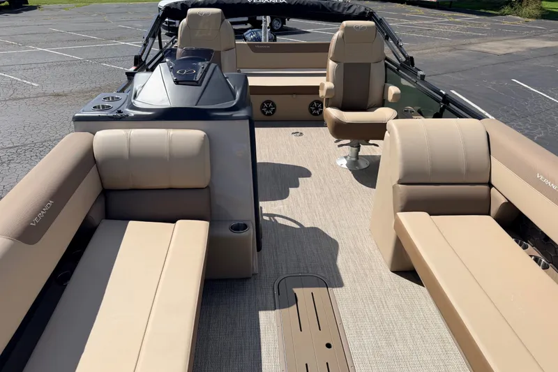 Slide: The Image of 2027 Veranda VR265VLC pontoon boat interior with beige seating and modern design. - 11