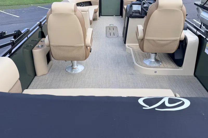Slide: The Image of Interior of 2027 Veranda VR265VLC boat with beige seating and modern dashboard. - 18