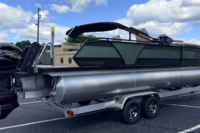 Slide: The Image of 2027 Veranda VR265VLC pontoon boat on trailer under a cloudy sky. - 8