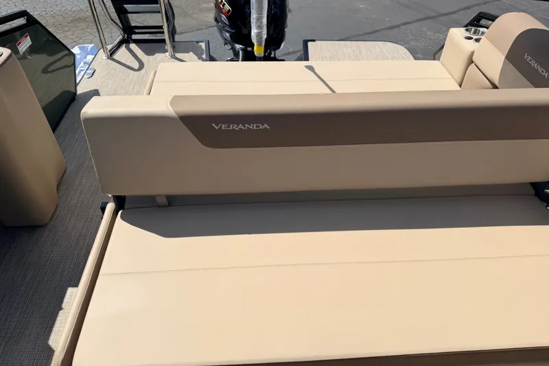 Slide: The Image of 2027 Veranda VR265VLC boat interior with beige seating and Veranda branding. - 22