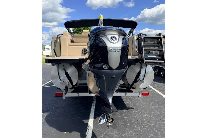 Slide: The Image of 2027 Veranda VR265VLC pontoon boat with powerful outboard motor, parked outdoors. - 7