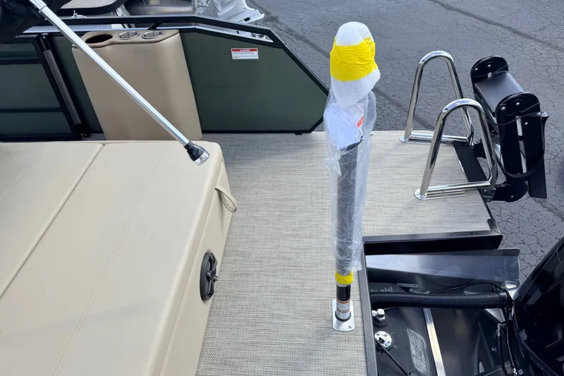 Slide: The Image of 2027 Veranda VR265VLC boat deck with seating, ladder, and wrapped pole. - 15