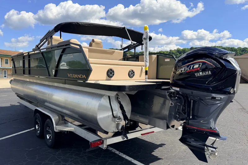 Slide: The Image of 2027 Veranda VR265VLC pontoon boat with Yamaha engine on trailer, under blue sky. - 5