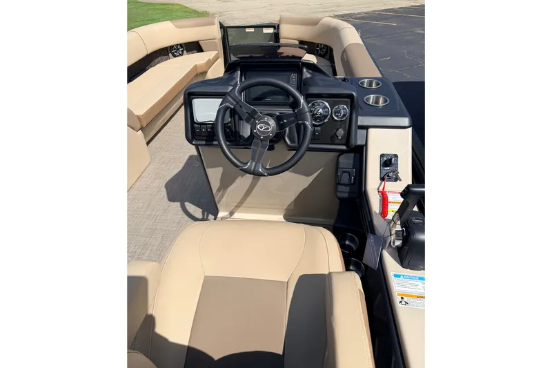Slide: The Image of 2027 Veranda VR265VLC boat interior with steering wheel and beige seating. - 19