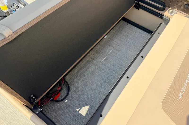 Slide: The Image of Open storage compartment in 2027 Veranda VR265VLC boat, showcasing interior space and design. - 21