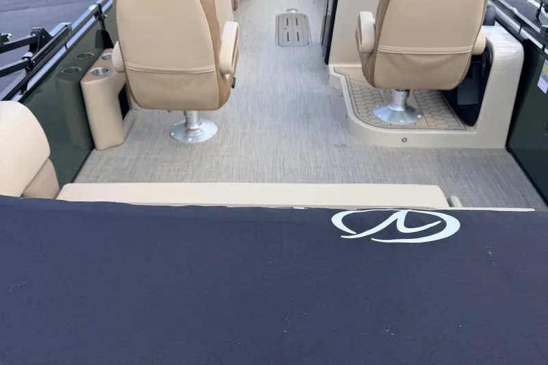 Slide: The Image of 2027 Veranda VR265VLC boat interior with beige seating and logo detail. - 17