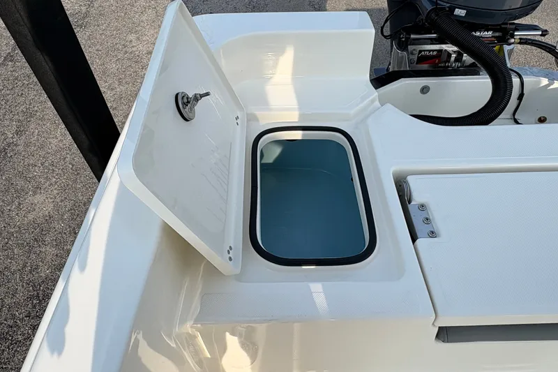 Slide: The Image of Open storage compartment on 2027 Pioneer 220 Bay Sport boat deck. - 15