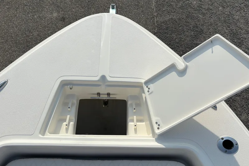 Slide: The Image of Open storage compartment on 2027 Pioneer 220 Bay Sport boat deck. - 32