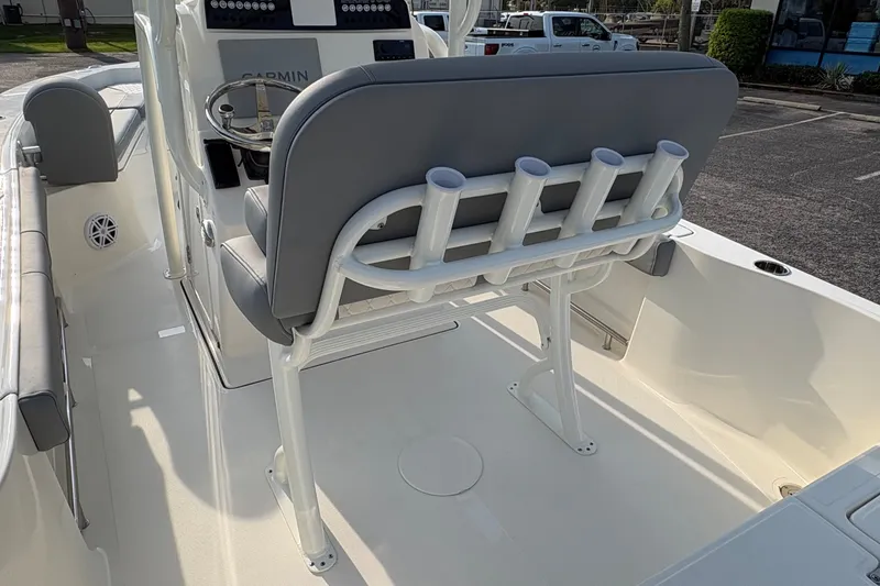 Slide: The Image of 2027 Pioneer 220 Bay Sport boat interior with seating and rod holders. - 16