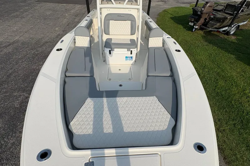 Slide: The Image of 2027 Pioneer 220 Bay Sport boat interior with cushioned seating and modern design. - 31