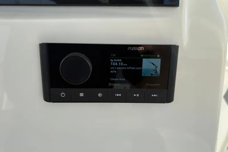 Slide: The Image of Fusion marine stereo display on a 2027 Pioneer 220 Bay Sport boat dashboard. - 21