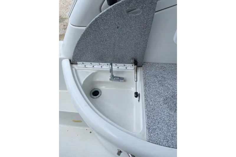 Slide: The Image of 2004 Formula 34 Performance Cruiser sink with hinged cover and drain. - 12