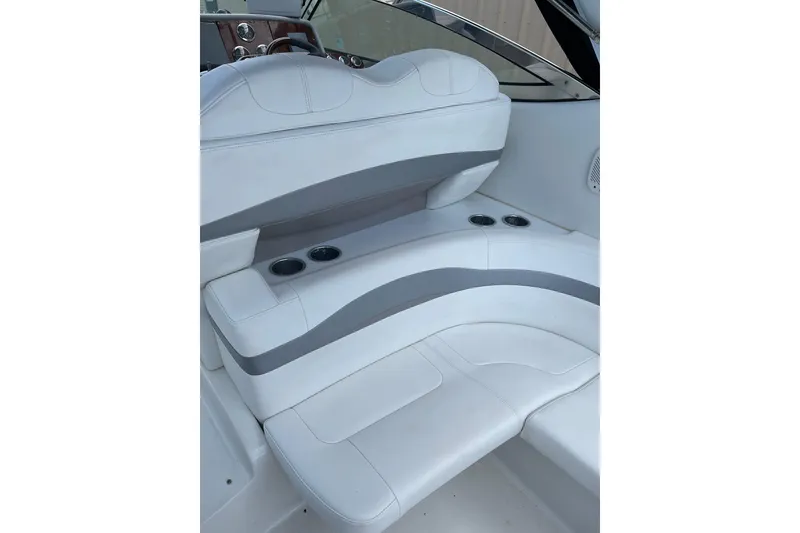 Slide: The Image of 2004 Formula 34 Performance Cruiser interior seating with cup holders and sleek design. - 7