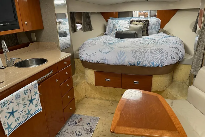 Slide: The Image of Interior of a 2004 Formula 34 Performance Cruiser with cozy bed and kitchenette. - 17