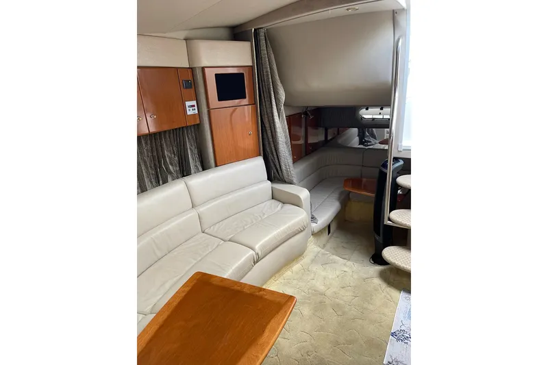 Slide: The Image of Interior of 2004 Formula 34 Performance Cruiser with beige seating and wooden accents. - 22