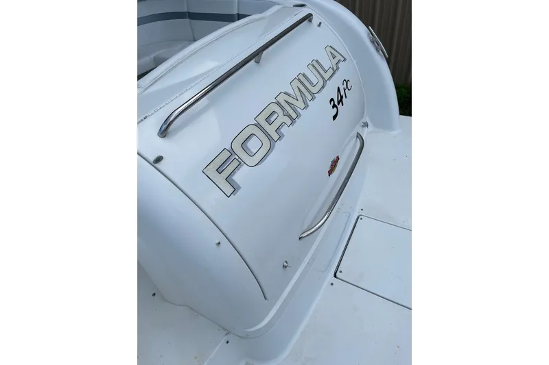Slide: The Image of 2004 Formula 34 Performance Cruiser boat, rear view with logo and model name. - 9