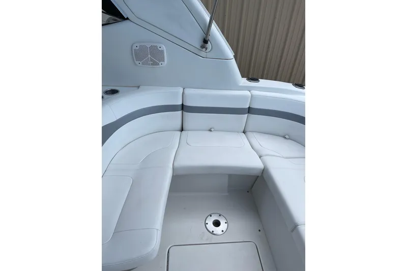 Slide: The Image of 2004 Formula 34 Performance Cruiser interior seating with sleek white and gray upholstery. - 8