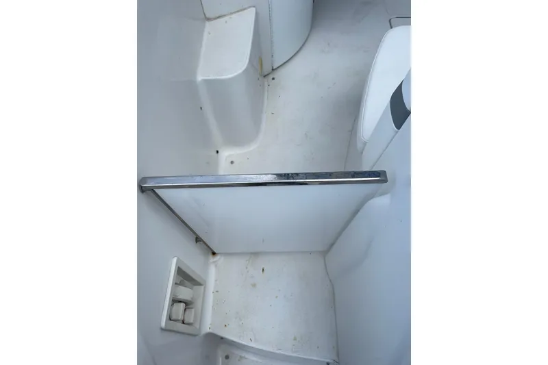 Slide: The Image of 2004 Formula 34 Performance Cruiser interior with white seating and clean flooring. - 11