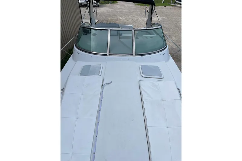 Slide: The Image of 2004 Formula 34 Performance Cruiser boat deck with sun pads and windshield. - 26