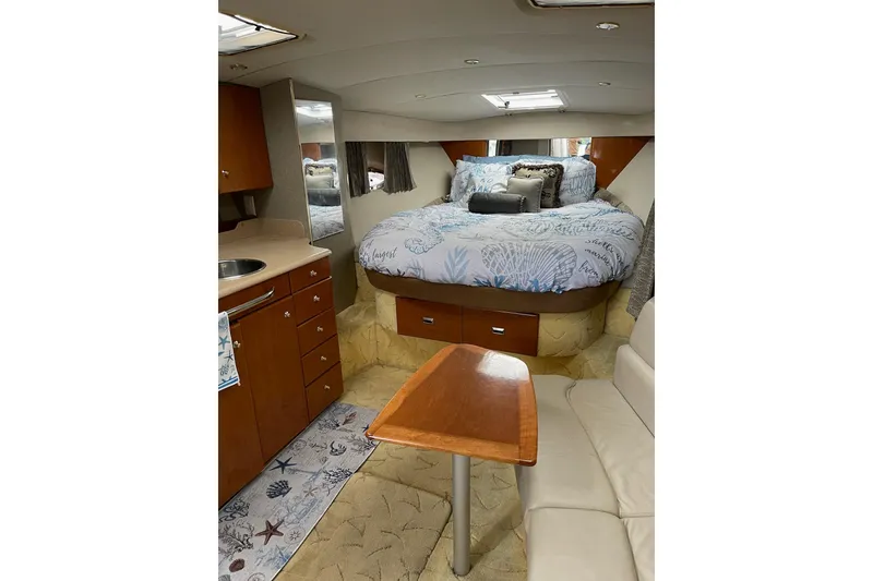 Slide: The Image of Interior of 2004 Formula 34 Performance Cruiser with cozy bed, kitchenette, and seating area. - 18