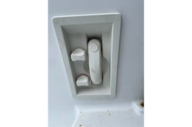 Slide: The Image of White handle on 2004 Formula 34 Performance Cruiser boat interior. - 14